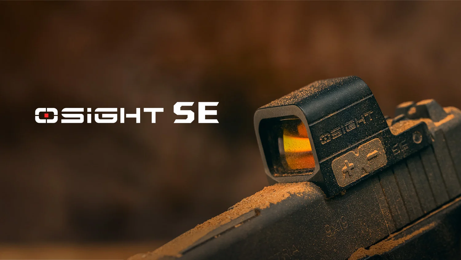 OSIGHT SE red dot sight mounted on a dusty pistol slide. Durable firearm optic for tactical use.